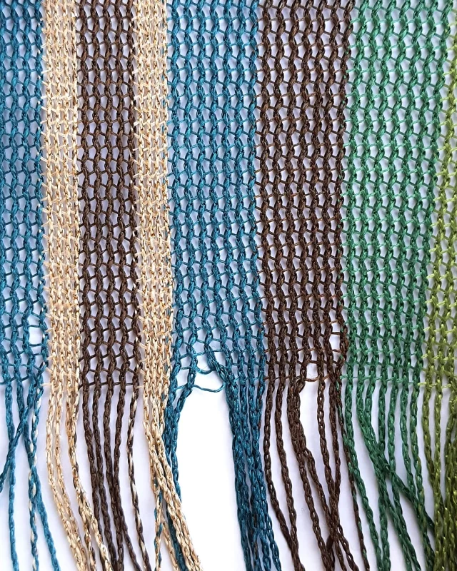 This scarf is knitted on a warp knit machine, which isn’t the conventional machine used to make knitwear. The warp yarns are threaded onto the machine, then the knitting action intermeshes these yarns vertically, to form fabric. 
See link in bio for details of our courses.
#mytrainedeye #trainingcourse #stripedscarf #knitwear #warpknit